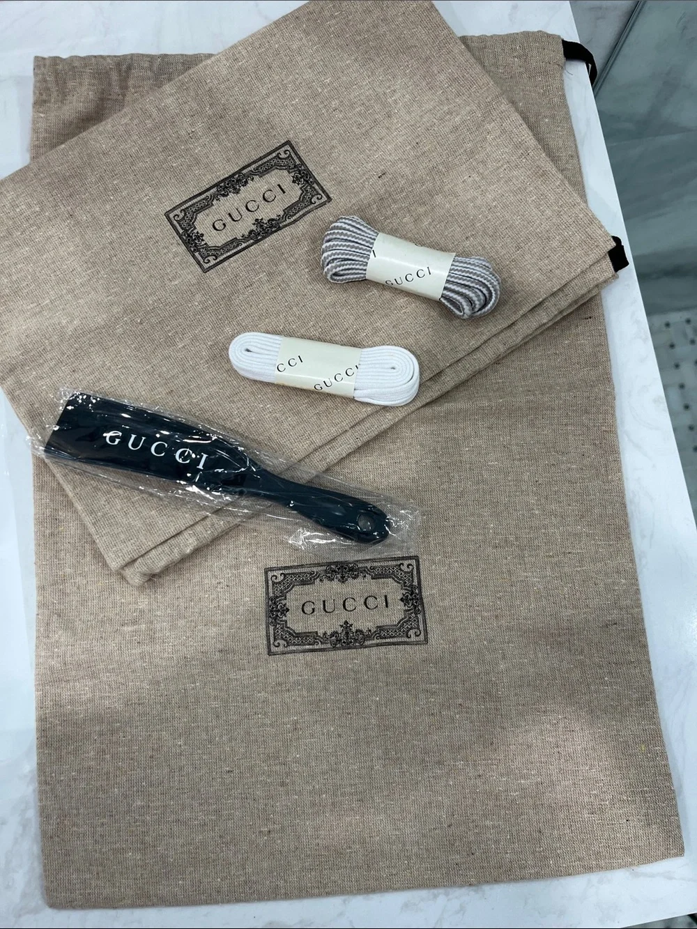 Gucci Beige Branded Dust Bags with Black Strap and White/Gray Laces